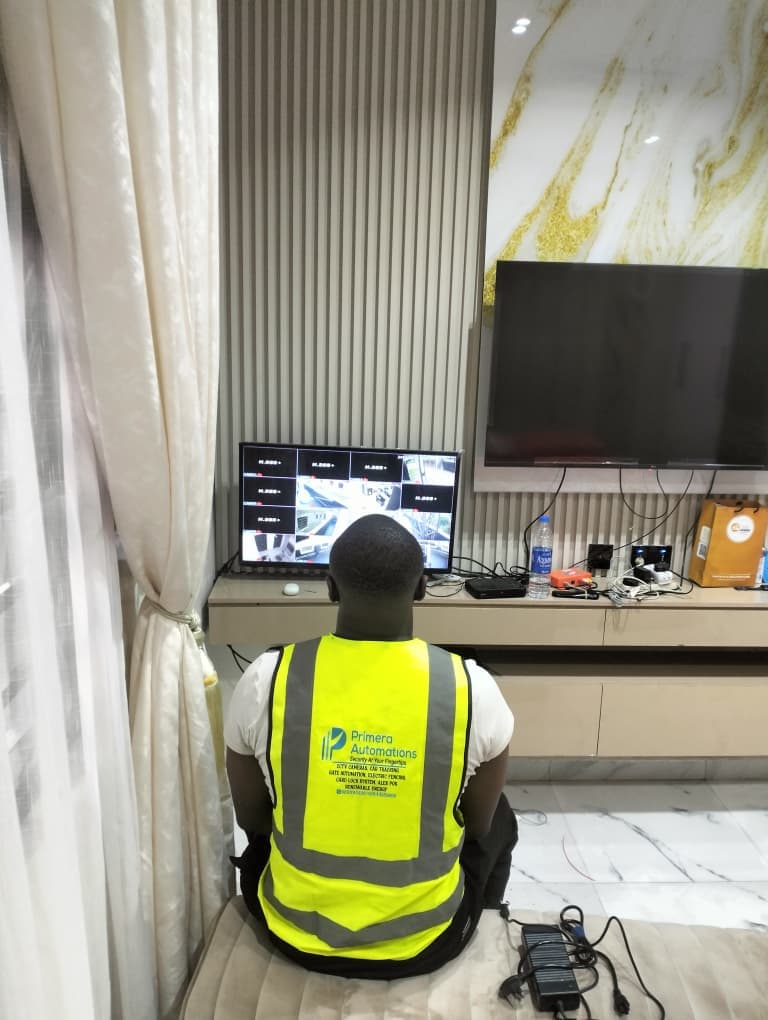 A Primera engineer commissioning a live CCTV monitoring feed on site